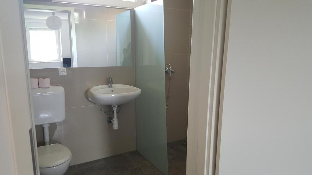 Łazienka w obiekcie Apartman Nóra