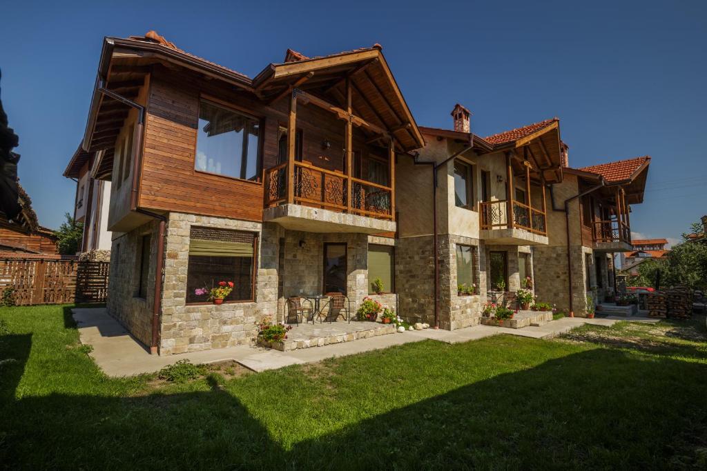 a large house with a yard at Rupchini Houses in Bansko