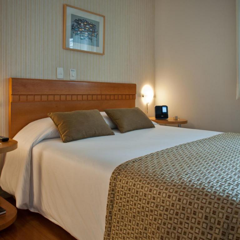 Cama ou camas em um quarto em Rio Hotel by Bourbon Curitiba