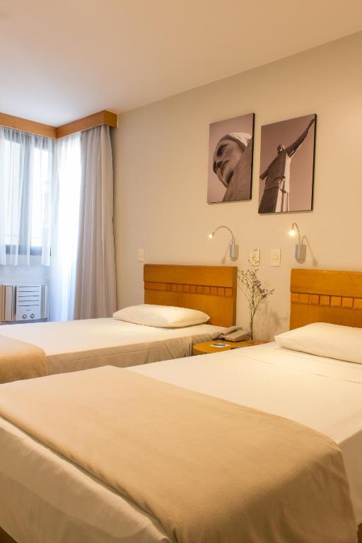 Cama ou camas em um quarto em Rio Hotel by Bourbon Curitiba