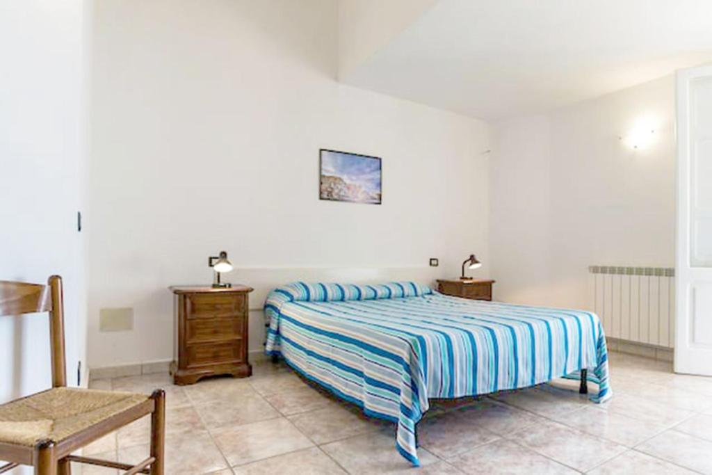 Un pat sau paturi într-o cameră la La Panoramica