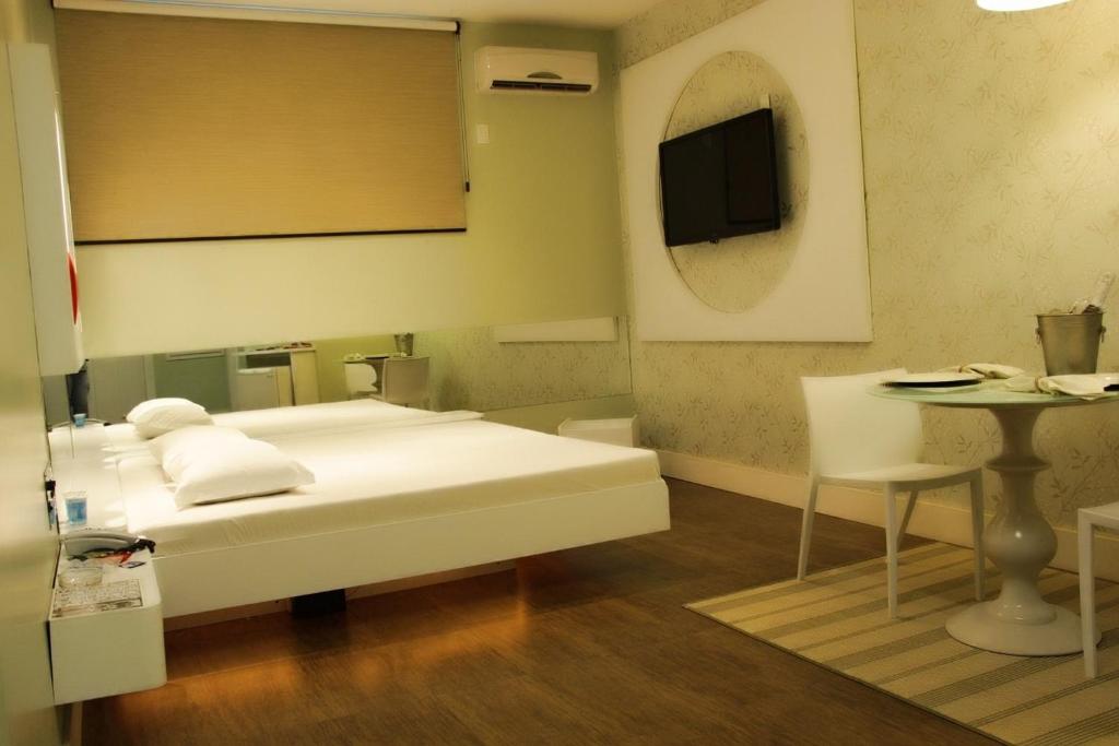 Postel nebo postele na pokoji v ubytování Pousada e Motel Blue Inn
