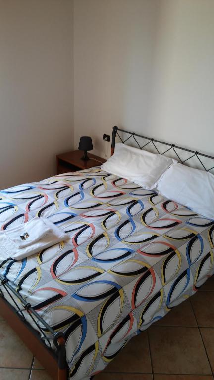A bed or beds in a room at Relais Corte Pontigliardo