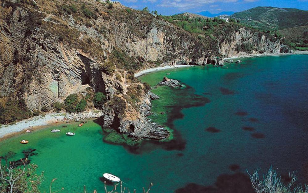 an aerial view of a beach with boats in the water at Sea House Kamaraton in Marina di Camerota