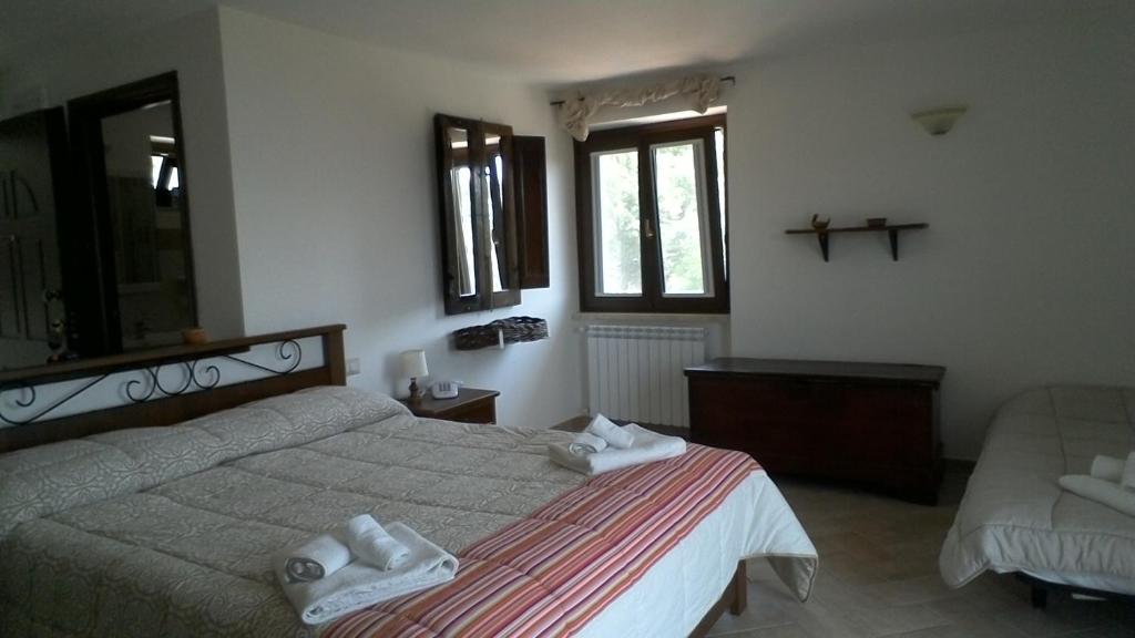 A bed or beds in a room at Cominium Benessere