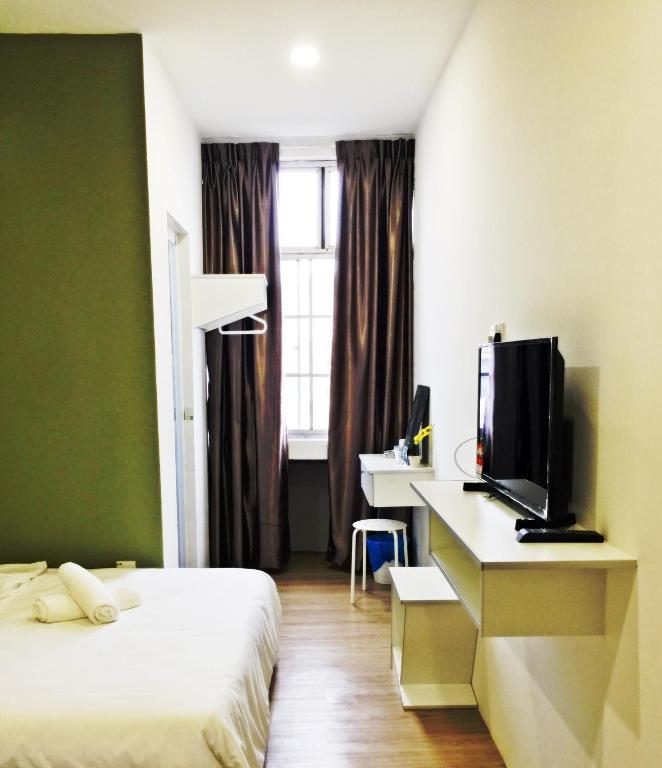 Postel nebo postele na pokoji v ubytování The b'Hotel