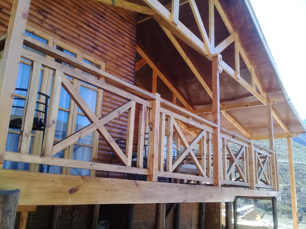 a house being built with wooden walls and windows at Jardin de Estrellas in Alcoguaz