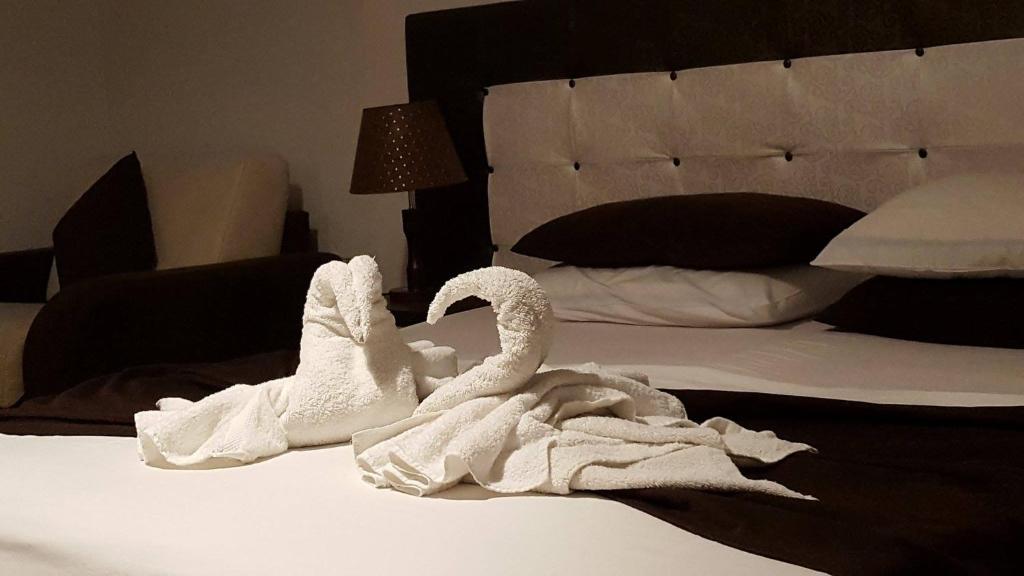 Postel nebo postele na pokoji v ubytování Hotel Livia