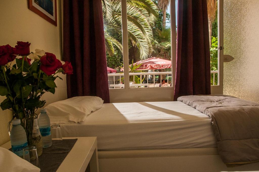 Postel nebo postele na pokoji v ubytování Hostal Alce