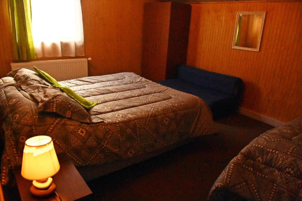 Una cama o camas en una habitación de Cabañas Patagonia Insitu