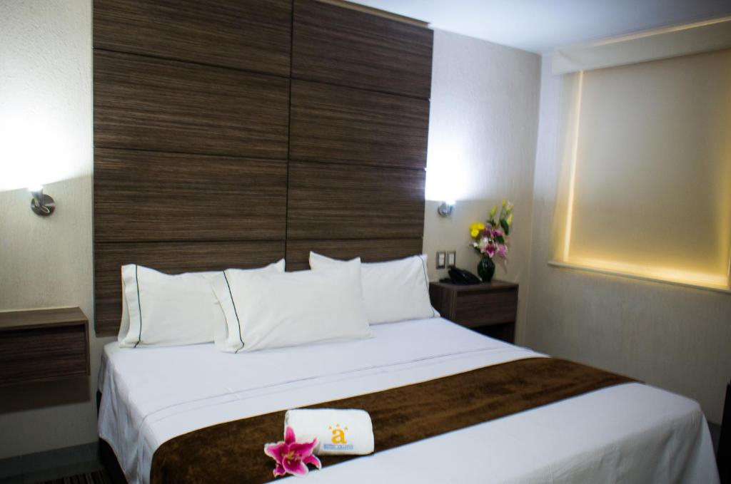 Postel nebo postele na pokoji v ubytování Hotel Expo Abastos