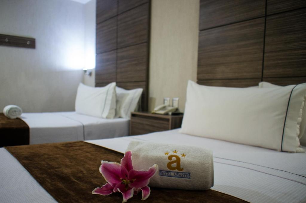 Postel nebo postele na pokoji v ubytování Hotel Expo Abastos
