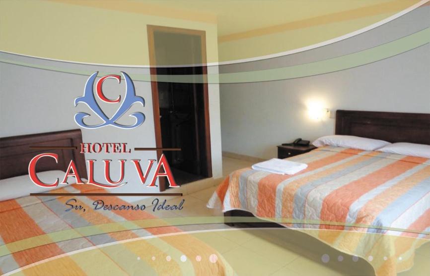 Postel nebo postele na pokoji v ubytování Hotel Caluva
