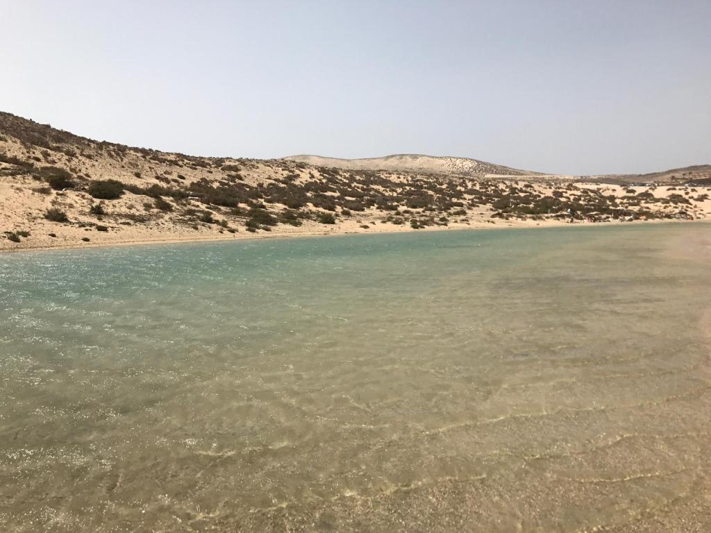 a view of a body of water in the desert at Residencial Playa Paraiso in Costa Calma
