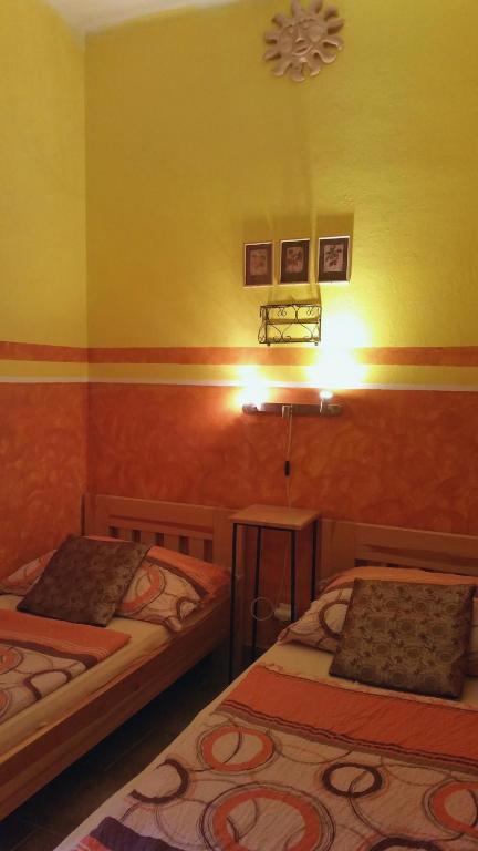 Ένα ή περισσότερα κρεβάτια σε δωμάτιο στο Hostel Merlin