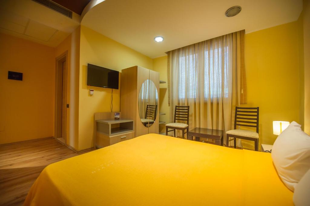 Postel nebo postele na pokoji v ubytování Luani A Hotel