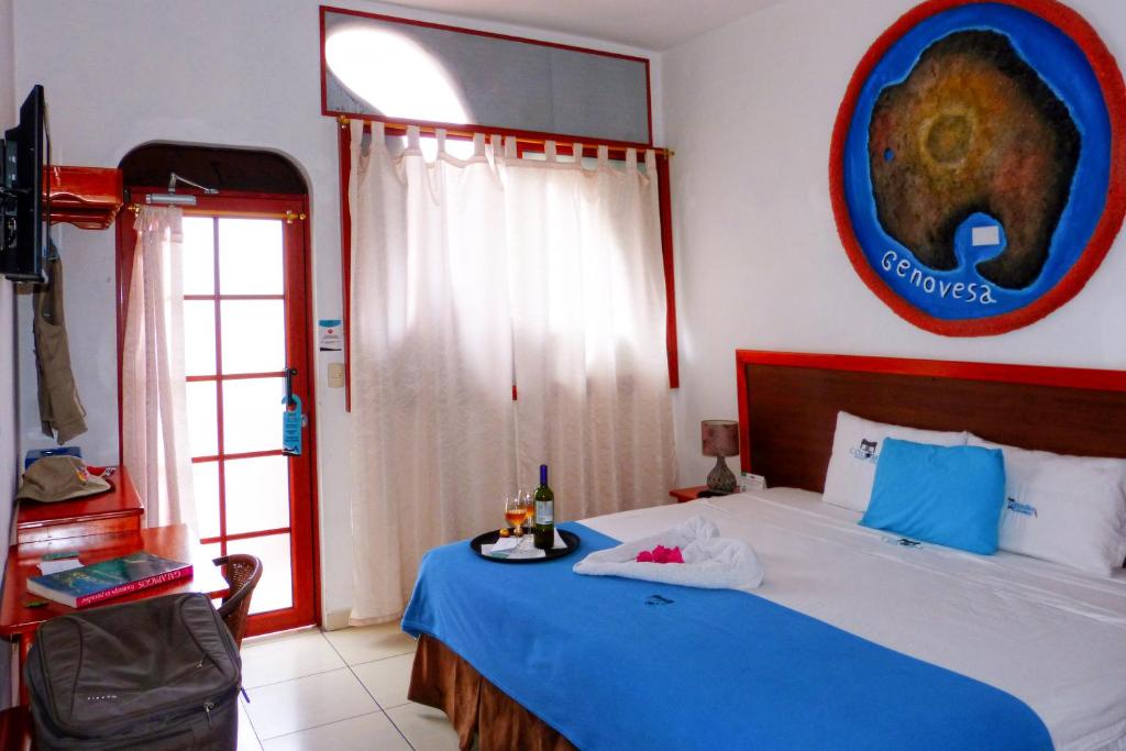 Postel nebo postele na pokoji v ubytování Hotel Coloma Galapagos
