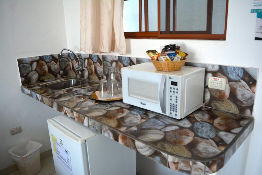 Kuchyň nebo kuchyňský kout v ubytování Hotel Coloma Galapagos