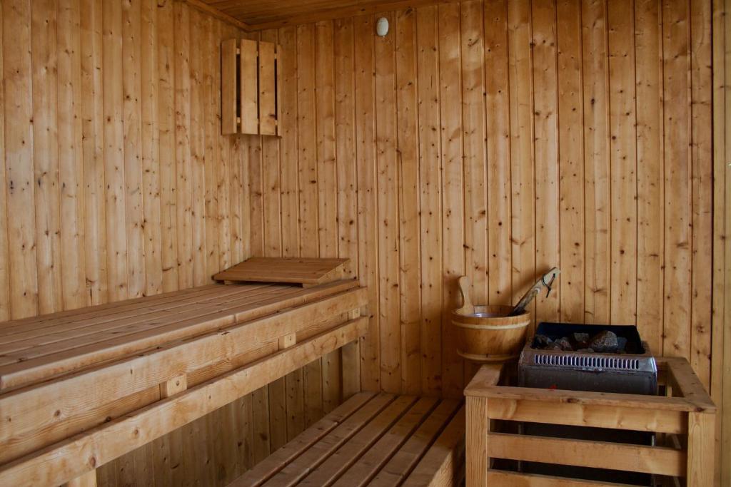 a wooden sauna with a toilet and a sink at Santa Cruz Ocean Villa in Gaula