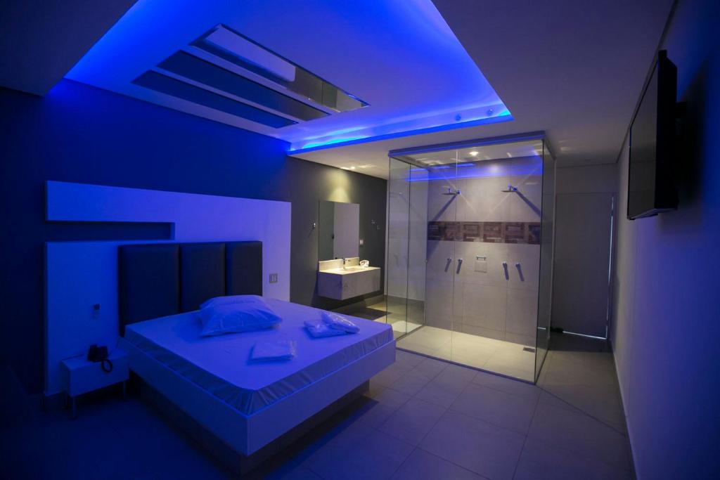 Postel nebo postele na pokoji v ubytování Hauss Excellence Motel