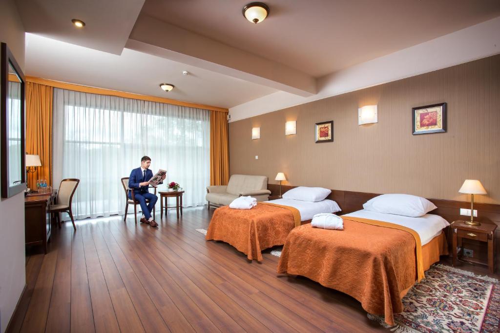 Posteľ alebo postele v izbe v ubytovaní Hotel Słoneczny Młyn