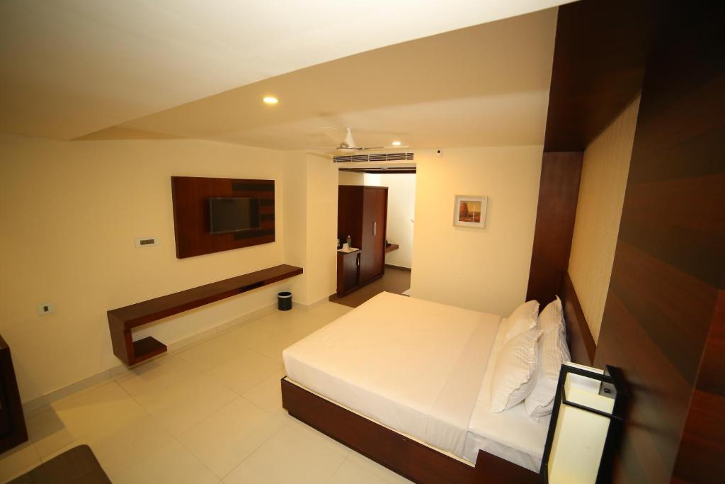 Postel nebo postele na pokoji v ubytování Vavas Inn & Suites