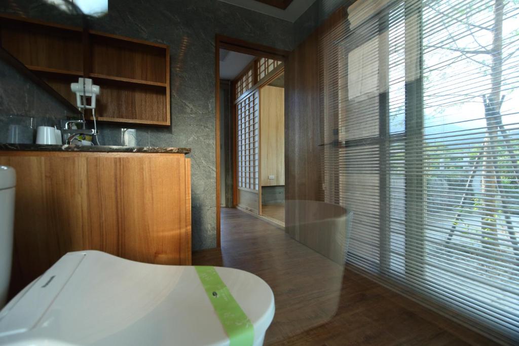 Postel nebo postele na pokoji v ubytování Chuying Sunrise B&B