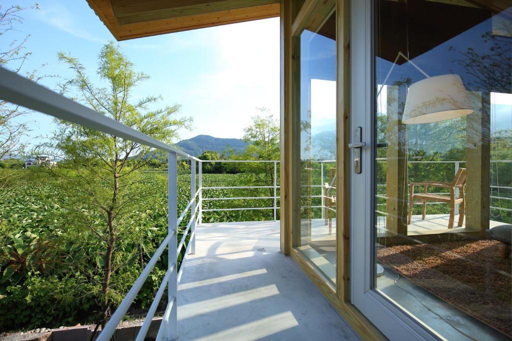 a glass door leading to a balcony with a view at Chuying Sunrise B&amp;B in Ji&#39;an