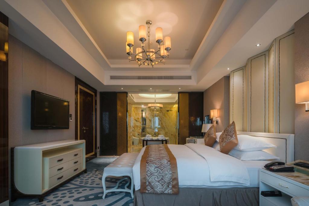 TV a/nebo společenská místnost v ubytování Happiness Hotel