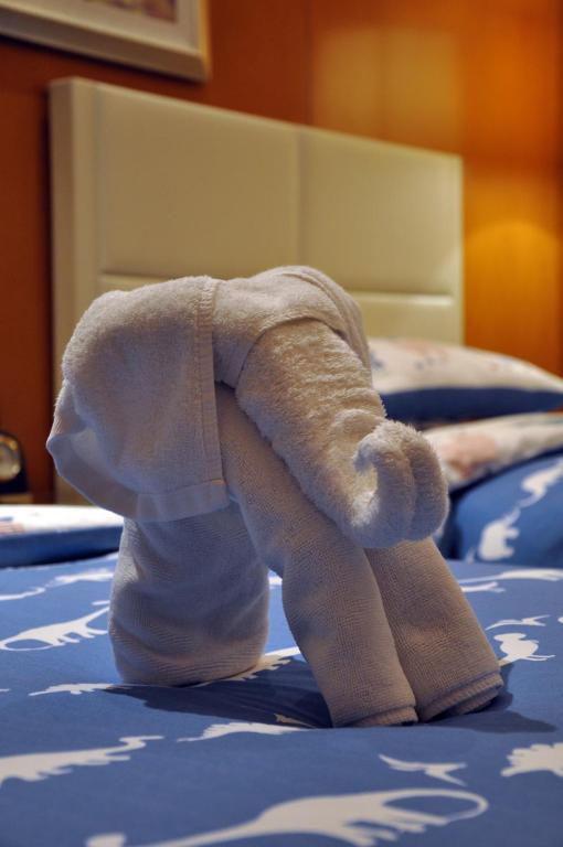 Postel nebo postele na pokoji v ubytování Happiness Hotel