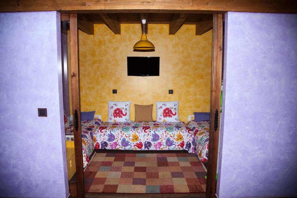 Posteľ alebo postele v izbe v ubytovaní Casa Rural el Ribero I