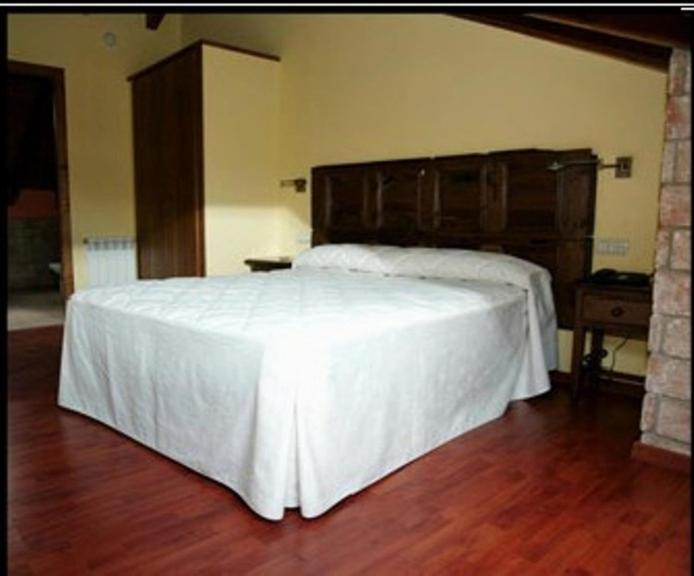 Postel nebo postele na pokoji v ubytování Hotel El Jaç