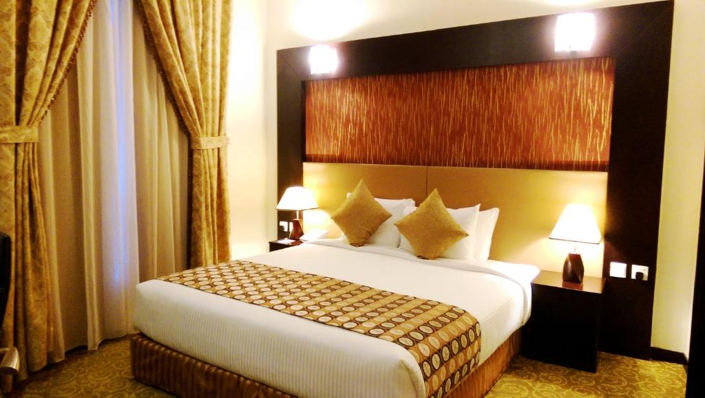 Postel nebo postele na pokoji v ubytování Aryana Hotel