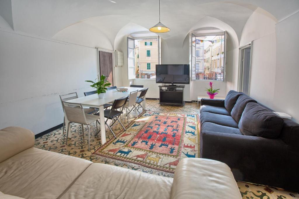 a living room with a couch and a table at Casa del Borgo in Finale Ligure