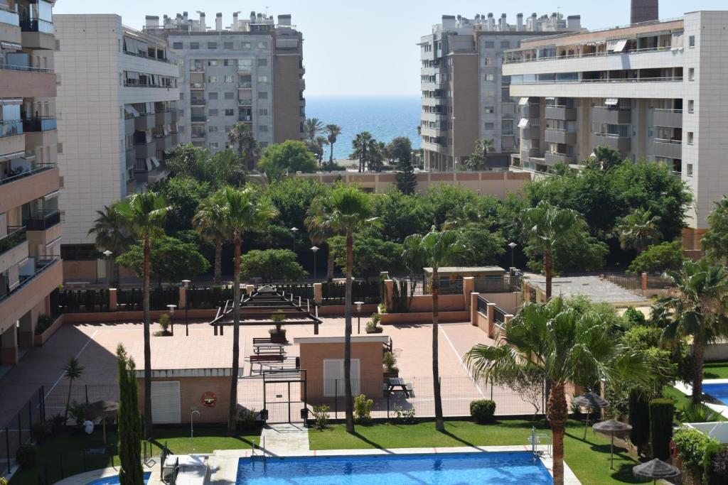 a view of a park with trees and buildings at Duplex Esperanza in Málaga