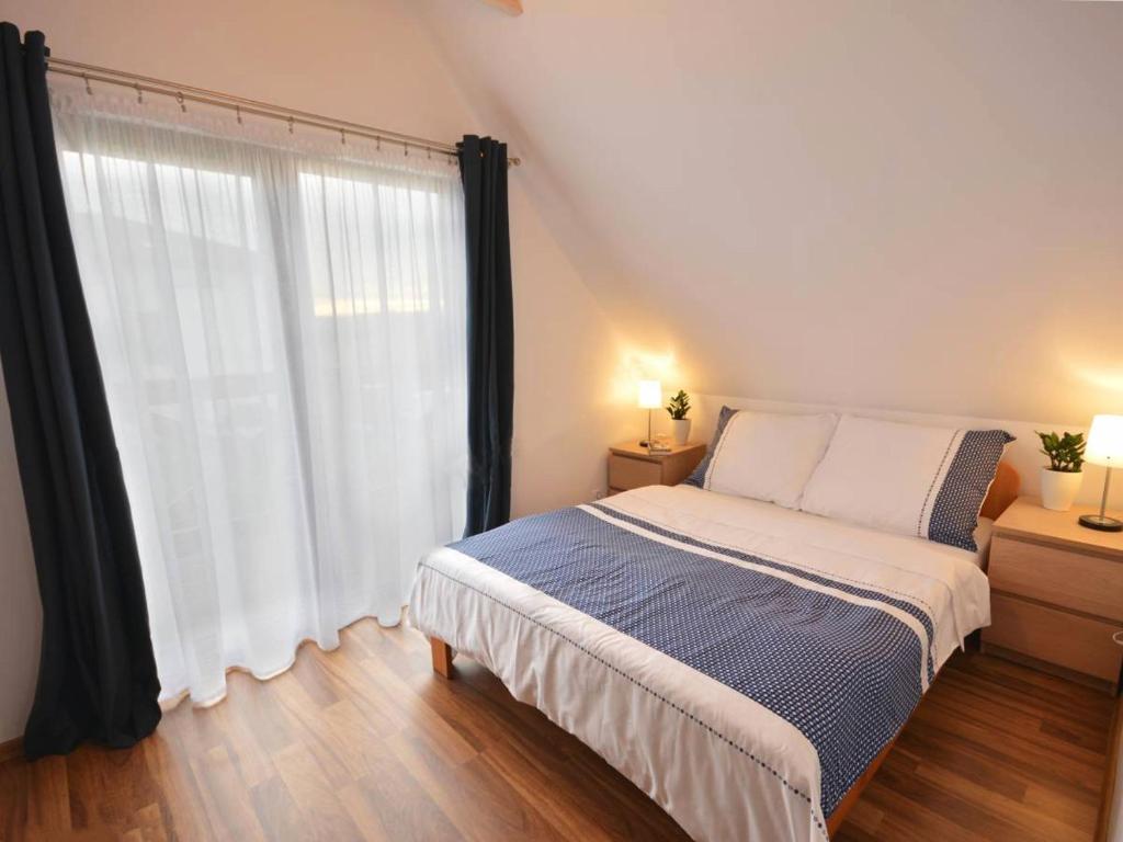 Postel nebo postele na pokoji v ubytování Domki wakacyjne 4 YOU