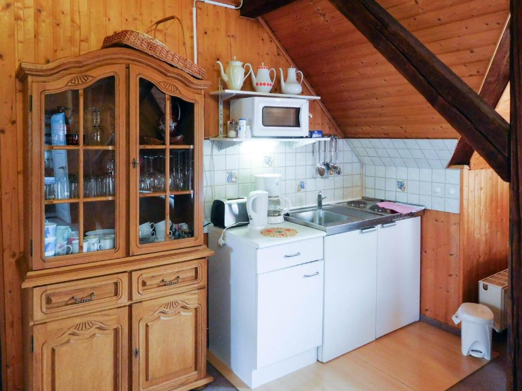 a kitchen with a sink and a microwave at Ferienwohnung Baade in Dresden