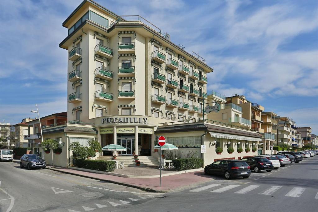 a large building on the corner of a street at Hotel Piccadilly in Lido di Camaiore