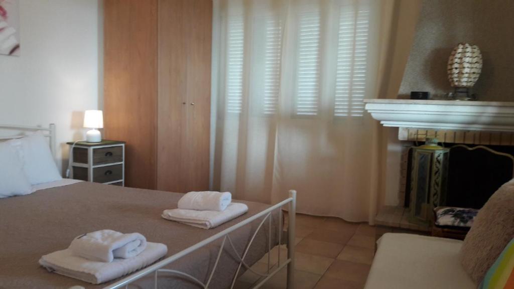 A bed or beds in a room at Foivos Seaside Apartments