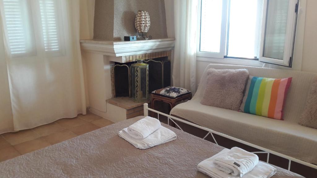 A bed or beds in a room at Foivos Seaside Apartments