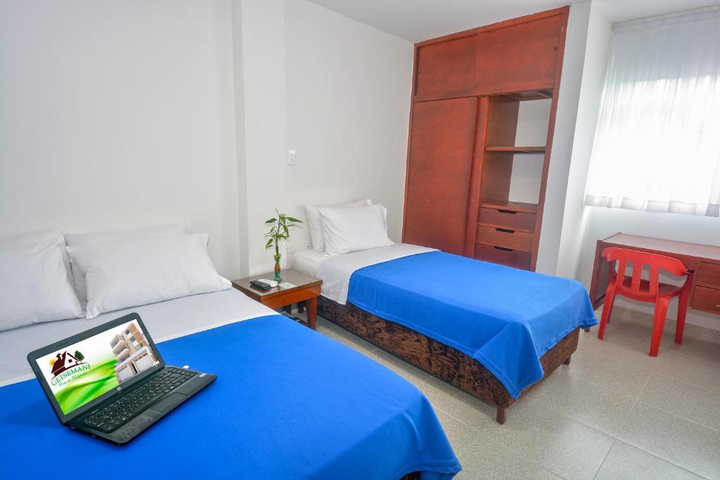 Säng eller sängar i ett rum på Hotel Getsemaní BGA
