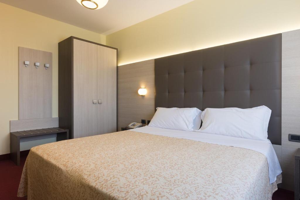 Postel nebo postele na pokoji v ubytování Park Hotel Ristorante Ca' Bianca