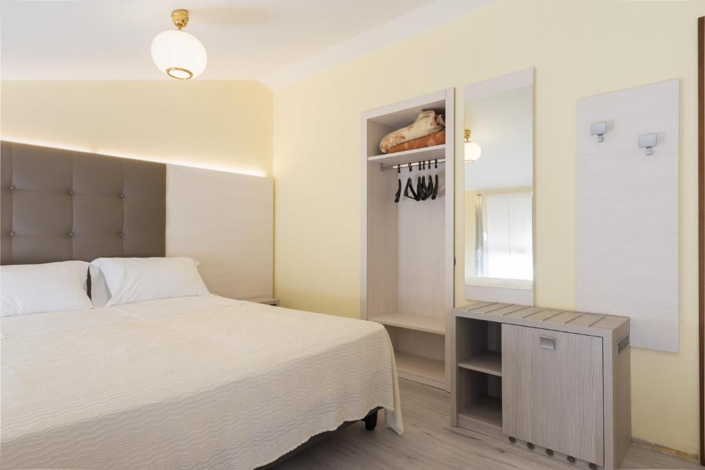 Postel nebo postele na pokoji v ubytování Park Hotel Ristorante Ca' Bianca