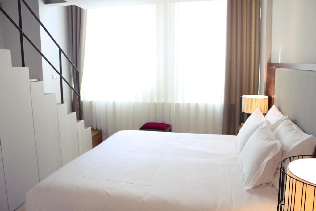 Postel nebo postele na pokoji v ubytování Burgus Tribute & Design Hotel