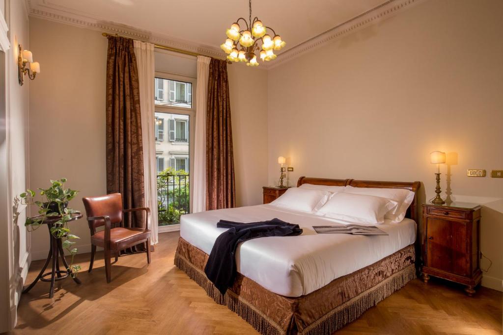 Postel nebo postele na pokoji v ubytování Hotel Locarno