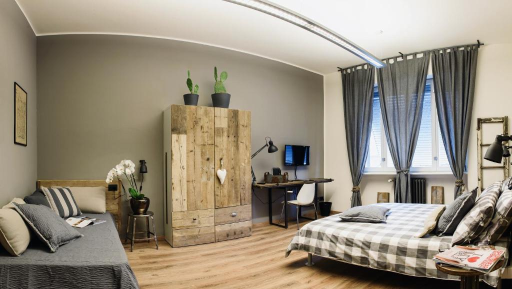 Postel nebo postele na pokoji v ubytování Suite11 Como apartment