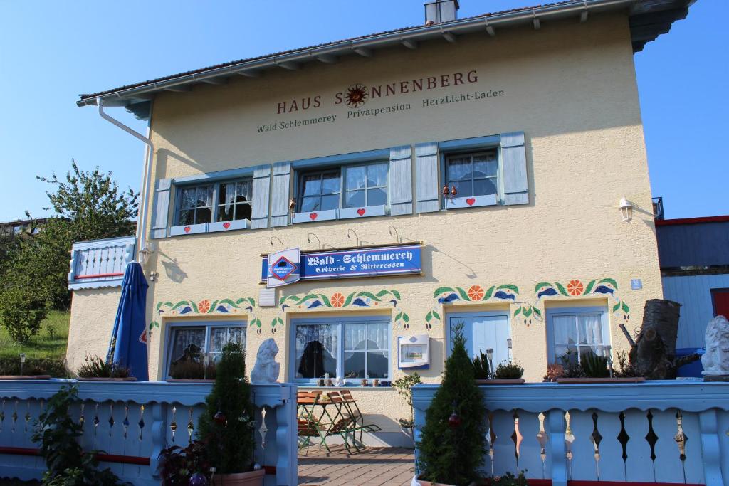 a building with a fence in front of it at Haus Sonnenberg in Sankt Oswald