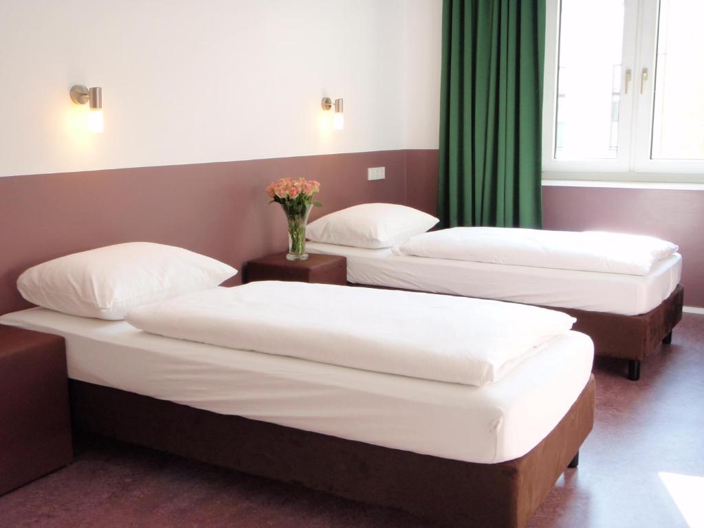 Postel nebo postele na pokoji v ubytování Grand Hostel Berlin Classic