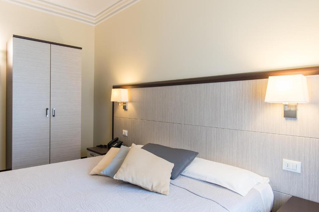 Cama o camas de una habitación en Hotel Alpi Resort