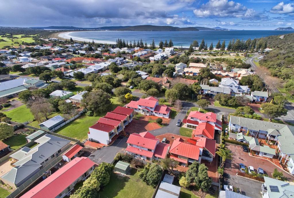 an aerial view of a town with houses and the ocean at Pelicans Albany Middleton Beach in Albany